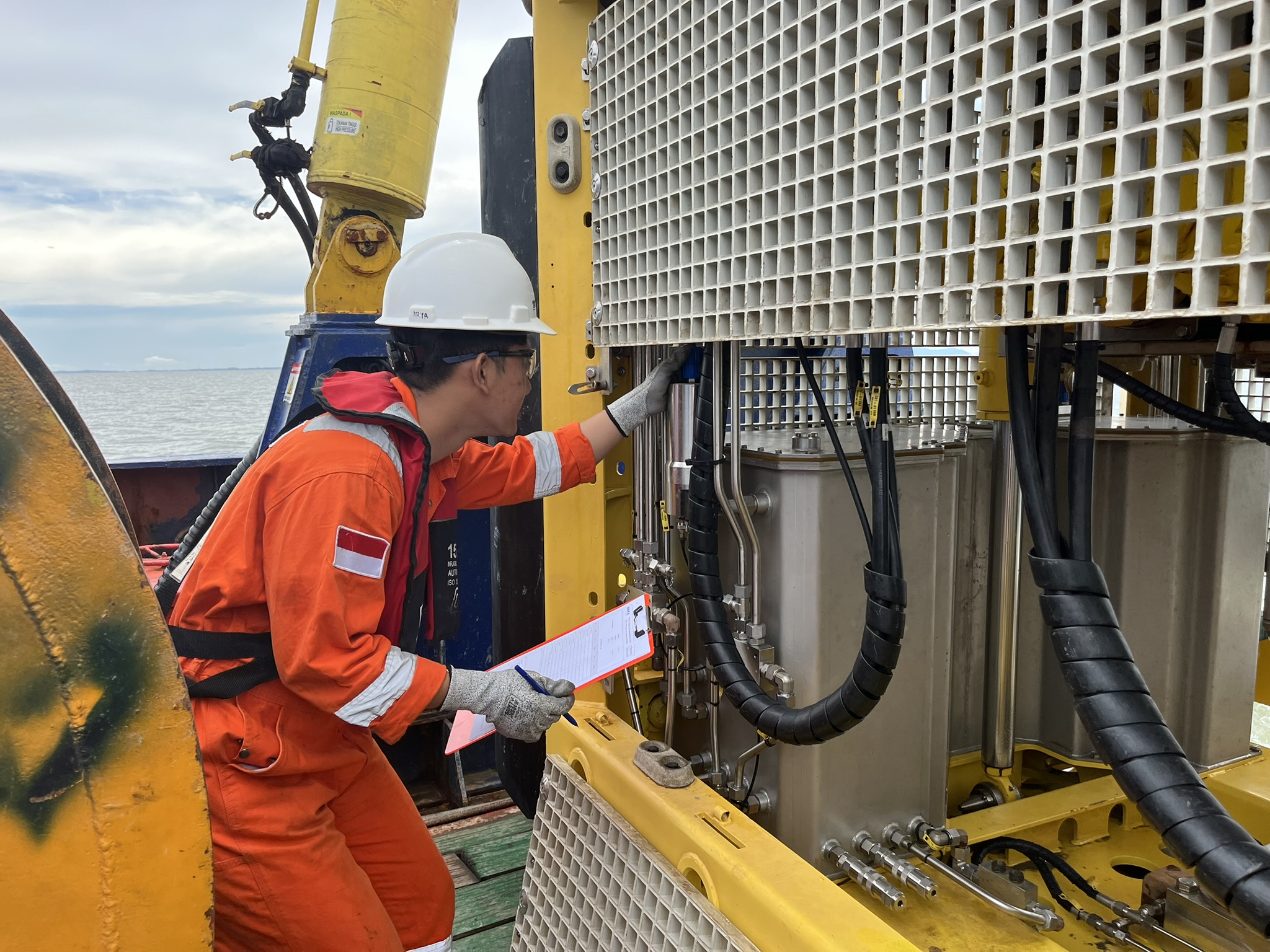 Technician inspecting turbomachinery